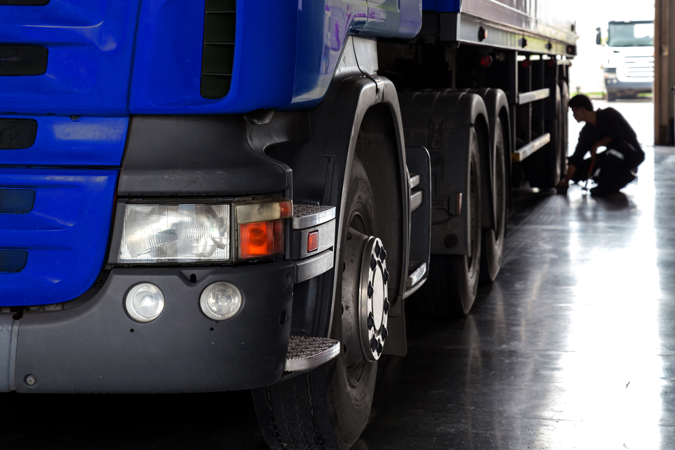 automobile mechanic checking truck in the garage, selective focu